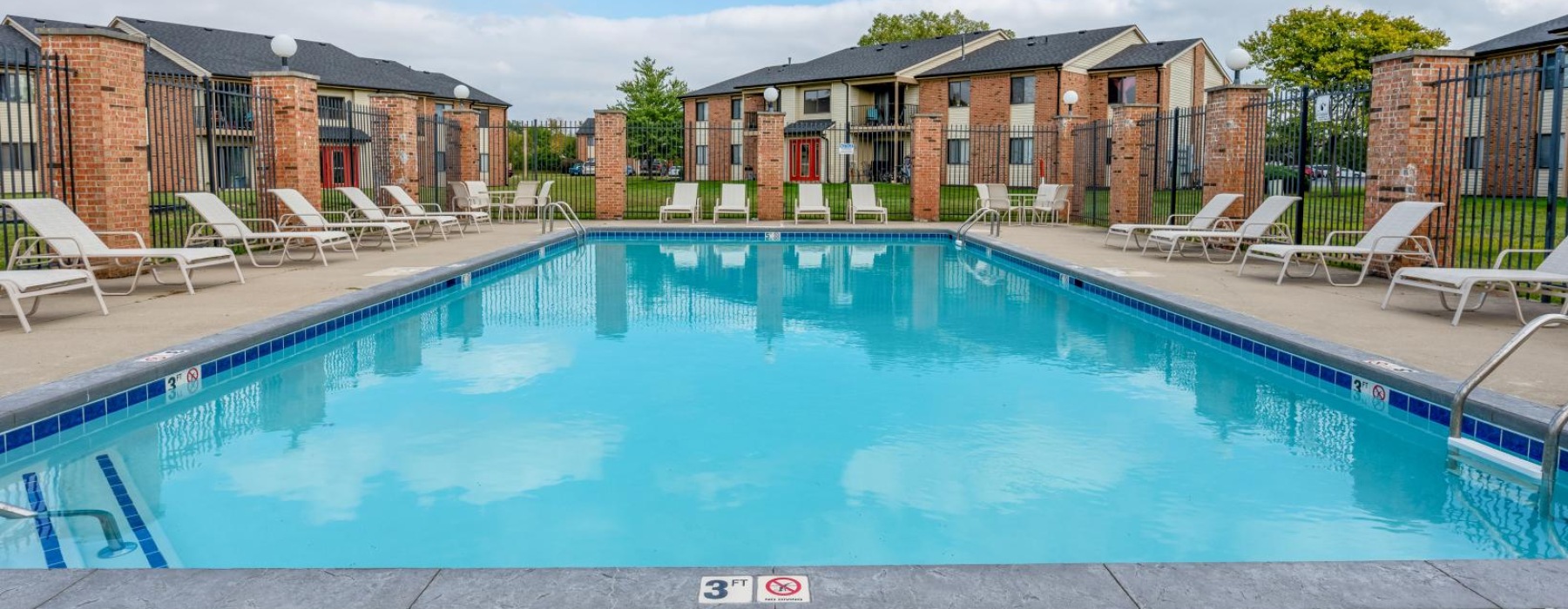 swimming pool with lounge chairs